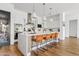 Bright kitchen with a large island, pendant lighting, and stainless steel appliances at 1500 E Sagittarius Pl, Chandler, AZ 85249