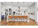 Modern kitchen with white cabinets, stainless steel appliances, and a large island at 1500 E Sagittarius Pl, Chandler, AZ 85249