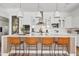 Modern kitchen featuring an island with seating and stainless steel appliances at 1500 E Sagittarius Pl, Chandler, AZ 85249