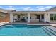 Backyard oasis with a covered patio, outdoor kitchen, and a sparkling pool for relaxation and entertainment at 1500 E Sagittarius Pl, Chandler, AZ 85249