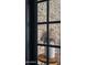 Close up of large picture window showing exposed brick wall at 1500 E Sagittarius Pl, Chandler, AZ 85249