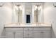 Bathroom vanity features double sinks, updated hardware and fixtures, and large mirrors at 1735 E Hope St, Mesa, AZ 85203