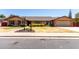 Charming single-story brick home with a well-maintained lawn and manicured landscaping at 1735 E Hope St, Mesa, AZ 85203
