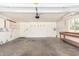 A spacious garage featuring multiple doors, workbench, and white walls at 1735 E Hope St, Mesa, AZ 85203