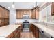 Well-equipped kitchen with stainless steel appliances, granite counters, and ample cabinet space at 1735 E Hope St, Mesa, AZ 85203