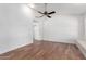 Bright living room features tile flooring, ceiling fan, and neutral-colored walls at 1735 E Hope St, Mesa, AZ 85203