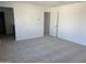 The large bedroom leads into an adjacent room, offering flexibility of use at 18001 W Lupine Ave, Goodyear, AZ 85338