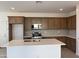 Beautiful kitchen featuring a large island, stainless steel appliances, and ample cabinet space at 18001 W Lupine Ave, Goodyear, AZ 85338