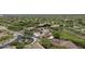 Wide aerial shot features community pool, desert landscaping, and lovely homes in a well-maintained neighborhood at 18127 N 98Th Way, Scottsdale, AZ 85255