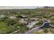 Stunning aerial view showcases a community pool area surrounded by lush landscaping and elegant buildings at 18127 N 98Th Way, Scottsdale, AZ 85255