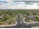 Community aerial view of gated entrance and neighborhood, with the desert landscape at 18127 N 98Th Way, Scottsdale, AZ 85255