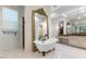 Bright bathroom showcasing a classic clawfoot tub, vanity area, and a separate glass-enclosed shower at 18127 N 98Th Way, Scottsdale, AZ 85255