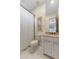 Cozy bathroom featuring a shower with a white curtain, a decorated wall art and a cream vanity at 18127 N 98Th Way, Scottsdale, AZ 85255