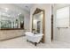 Luxurious bathroom featuring an elegant clawfoot tub, vanity area and a separate walk-in shower at 18127 N 98Th Way, Scottsdale, AZ 85255