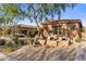 Outdoor seating area with lush landscaping and stone accents, perfect for relaxing at 18127 N 98Th Way, Scottsdale, AZ 85255