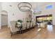 Open-concept living and dining area featuring high ceilings and natural light at 18127 N 98Th Way, Scottsdale, AZ 85255