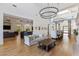 Expansive living area with high ceilings, hardwood floors, and elegant lighting fixtures at 18127 N 98Th Way, Scottsdale, AZ 85255