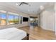Bright main bedroom with an outside patio access and large windows offering beautiful mountain views at 18127 N 98Th Way, Scottsdale, AZ 85255