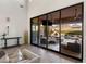 Spacious indoor/outdoor living transition to a covered patio, pool, and mountain views at 18127 N 98Th Way, Scottsdale, AZ 85255
