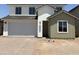 New two-story home featuring a two-car garage with a xeriscaped front yard at 18162 W Larkspur Dr, Goodyear, AZ 85338