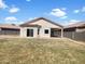 Spacious backyard with a covered patio, perfect for outdoor entertaining at 19707 N Pepka Ct, Maricopa, AZ 85138