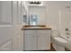 Well-maintained bathroom featuring a vanity with ample counter space, and a toilet and shower-tub combo at 19707 N Pepka Ct, Maricopa, AZ 85138