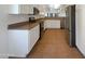 Spacious kitchen with modern stainless steel appliances and ample cabinet space at 19707 N Pepka Ct, Maricopa, AZ 85138
