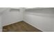 Spacious walk-in closet with ample shelving and rack space for maximum storage capacity at 19707 N Pepka Ct, Maricopa, AZ 85138