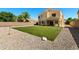 Large backyard with manicured artificial turf, perfect for outdoor enjoyment at 2036 E Carob Dr, Chandler, AZ 85286