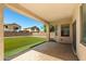 Covered patio overlooks the lush, green backyard of this lovely home at 2036 E Carob Dr, Chandler, AZ 85286