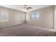 Bedroom featuring carpet and multiple windows that provide great natural light at 2036 E Carob Dr, Chandler, AZ 85286