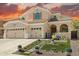 Charming two-story home with desert landscaping, attached two-car garage and barrel tile roof at 2036 E Carob Dr, Chandler, AZ 85286