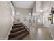 Bright foyer featuring tile flooring, soaring ceilings, staircase and natural light from multiple windows at 2036 E Carob Dr, Chandler, AZ 85286