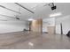Spacious garage featuring epoxy flooring and built-in storage cabinets at 2036 E Carob Dr, Chandler, AZ 85286