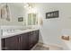 Bathroom with a double sink vanity, decorative lighting, and modern finishes at 23386 N 73Rd Way, Scottsdale, AZ 85255