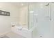 Bathroom featuring a separate bathtub and shower with glass enclosure at 23386 N 73Rd Way, Scottsdale, AZ 85255