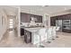 Modern kitchen with stainless steel appliances, white countertops, and a breakfast bar with seating at 23386 N 73Rd Way, Scottsdale, AZ 85255