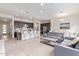 Bright, open-concept living area featuring modern kitchen with stainless steel appliances and a cozy sitting area at 23386 N 73Rd Way, Scottsdale, AZ 85255