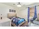 bedroom with a space themed bed and accents, window, and closet at 25218 W Carson Ct, Buckeye, AZ 85326