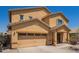 Charming home with a two-car garage, covered porch, and desert landscaping for easy maintenance at 25218 W Carson Ct, Buckeye, AZ 85326