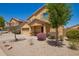 Beautiful home with desert landscaping and a cozy front porch, perfect for enjoying the outdoors at 25218 W Carson Ct, Buckeye, AZ 85326