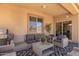 Comfortable outdoor patio featuring wicker furniture, a ceiling fan, and a grill for cooking at 25218 W Carson Ct, Buckeye, AZ 85326