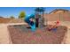 Backyard playground featuring a slide, climbing wall, and geometric dome for entertainment at 25218 W Carson Ct, Buckeye, AZ 85326