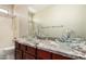 Bathroom with double sinks, granite countertops, and glass vessel sinks at 2602 E Glass Ln, Phoenix, AZ 85042
