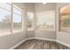 Inviting bedroom with natural light pouring through the windows with hardwood floors at 2602 E Glass Ln, Phoenix, AZ 85042