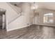 This grand living room features high ceilings, wood floors, and a staircase to the second story at 2602 E Glass Ln, Phoenix, AZ 85042