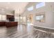 Open floor plan with kitchen view, great for entertaining with hardwood floors and high ceilings at 2602 E Glass Ln, Phoenix, AZ 85042