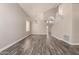 This open-concept living room features high ceilings, wood floors, and a staircase at 2602 E Glass Ln, Phoenix, AZ 85042