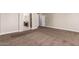 Spacious carpeted main bedroom featuring a glimpse of the ensuite bathroom at 2602 E Glass Ln, Phoenix, AZ 85042