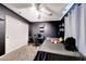 Cozy bedroom with dark accent wall, desk, and plush carpet, providing a comfortable and private space at 2716 W Sunland Ave, Phoenix, AZ 85041